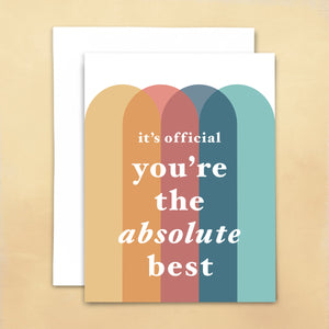 It's official- you're the absolute best greeting card in white font atop multi-colored overlapping vertical arches on white background