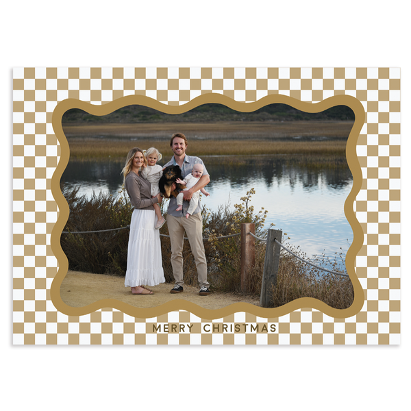 Custom holiday photo card with single horizontal photo surrounded by irregular scalloped border and gold and white checkered background
