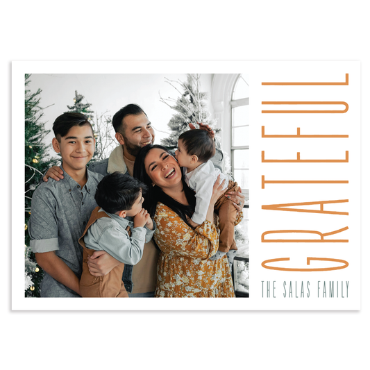 Custom holiday photo card with square image and 'GRATEFUL' text overlay on a white background in horizontal orientation