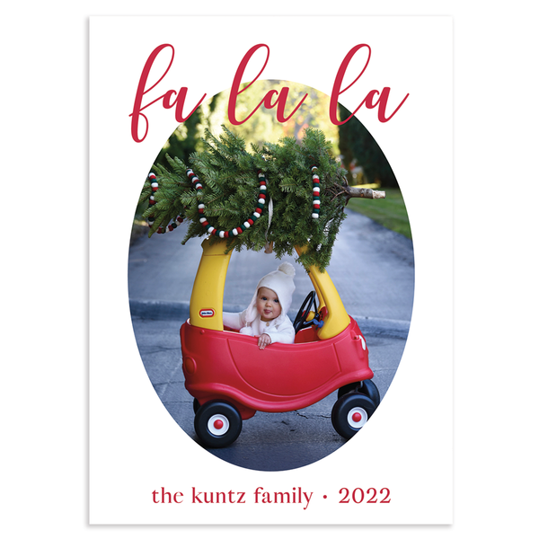 Custom holiday photo card, fa la la in red script font atop oval photo on white background