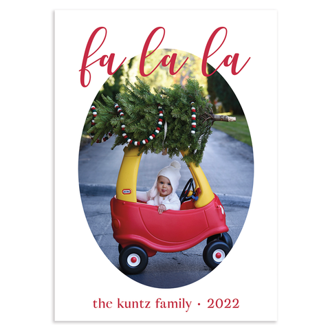Custom holiday photo card, fa la la in red script font atop oval photo on white background