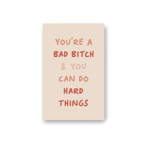 Front cover of dot grid pocket notebook with text YOU'RE A BAD BITCH & YOU CAN DO HARD THINGS in shades of pink and coral on blush background