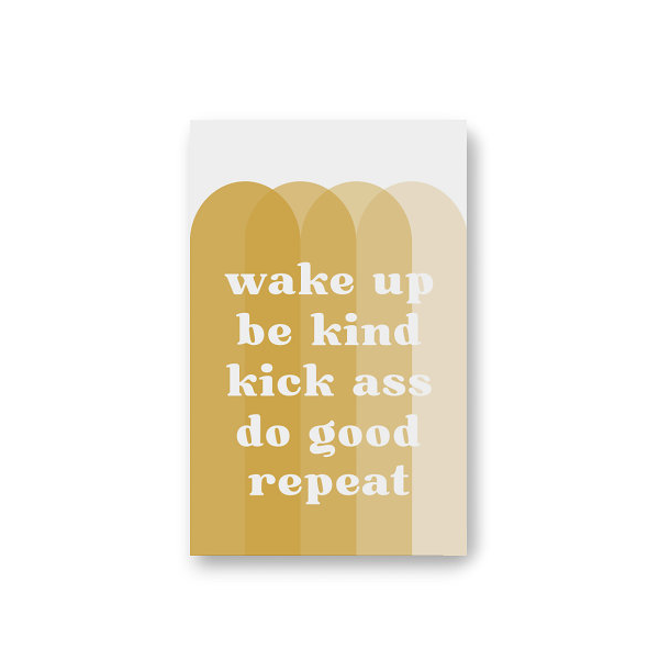 Front cover of dot grid pocket notebook with large white text WAKE UP BE KIND KICK ASS DO GOOD REPEAT atop 4 overlapping vertical arches in various shades of gold