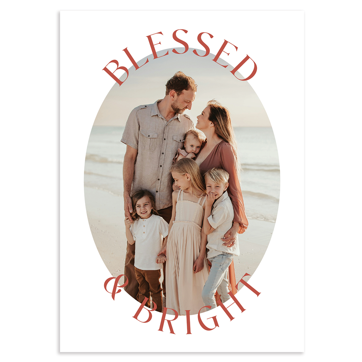 Custom holiday photo card, blessed & bright in pink font atop oval photo on white background