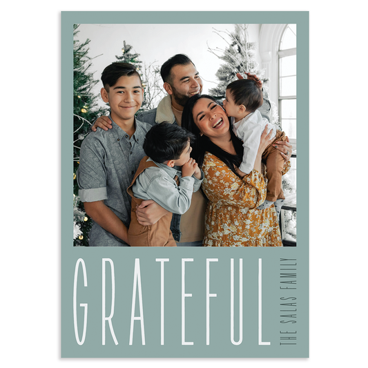 Custom holiday photo card with square image and 'GRATEFUL' text overlay on a light blue background