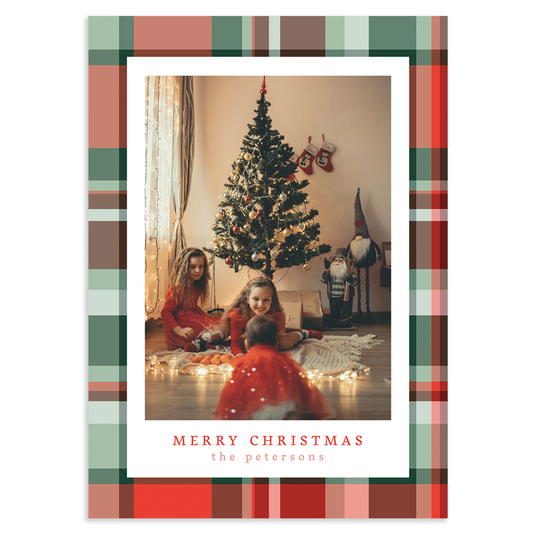 Custom holiday photo card with single vertical image with white border on a red and green plaid background