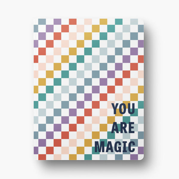 Front cover of dot grid 72-page notebook with soft touch cover; rainbow checkered pattern alternating with white with "You are magic" text in navy block letters