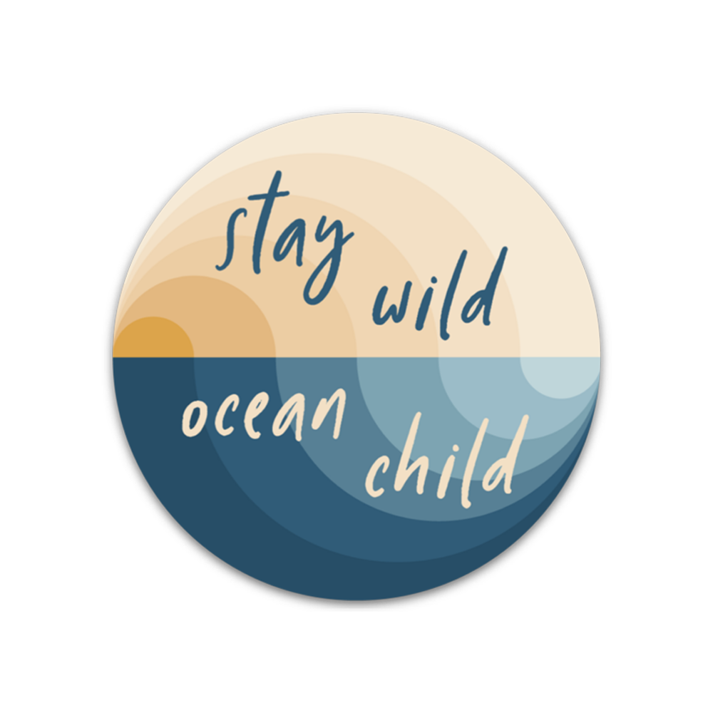 3" round vinyl sticker with text 'stay wild ocean child' atop concentric semi-circles in blue and gold hues creating the illusion of a beach wave with a sunset above