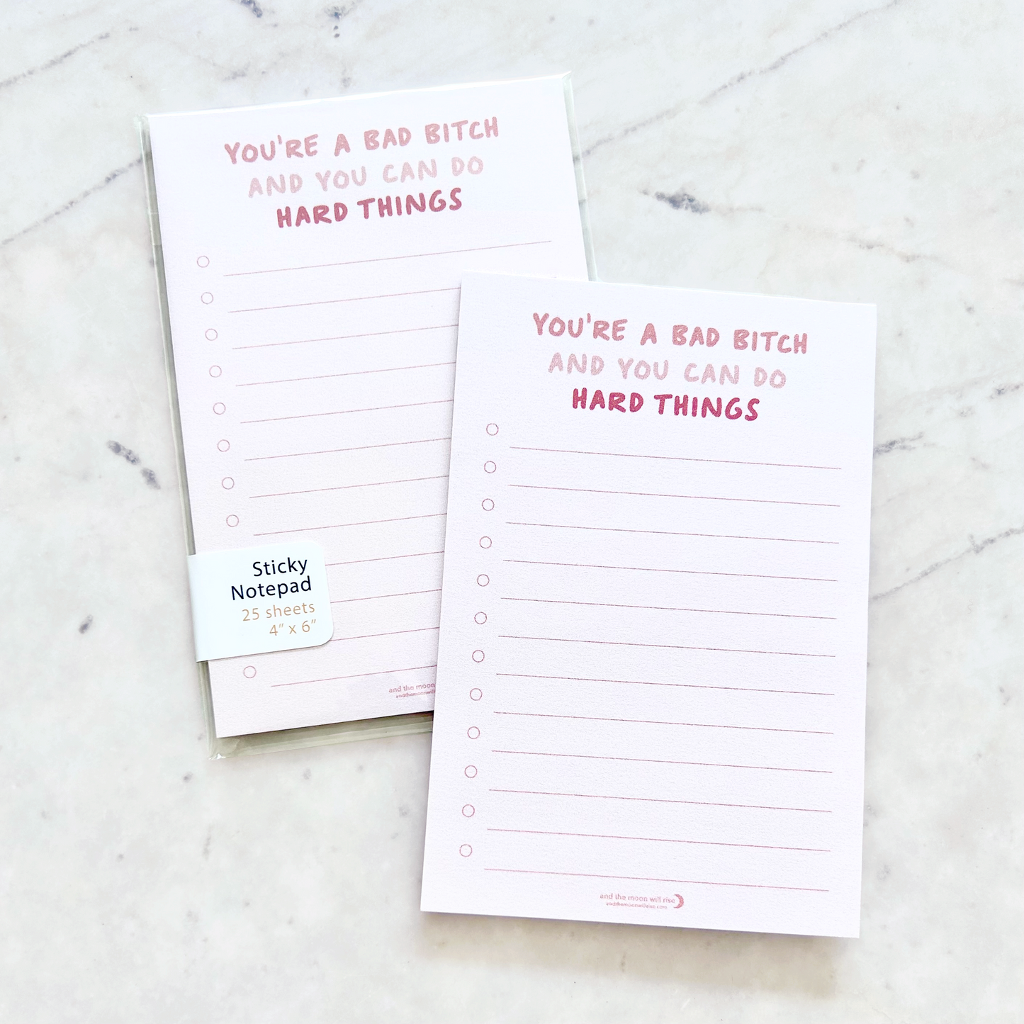 4"W x 6"L sticky notepad; "you're a bad bitch and you can do hard things" in pink font at top with 12 horizontal light pink lines for list making on light pink background