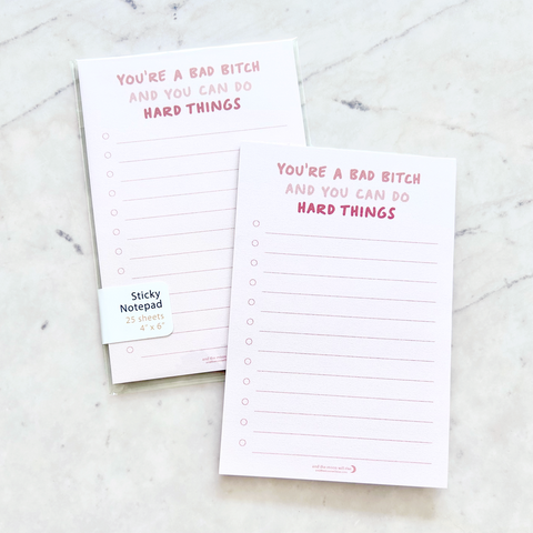 4"W x 6"L sticky notepad; "you're a bad bitch and you can do hard things" in pink font at top with 12 horizontal light pink lines for list making on light pink background