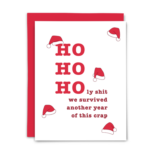 Card with 'HO HO Holy shit we survived another year of this crap' text and Santa hats on a white background with red envelope