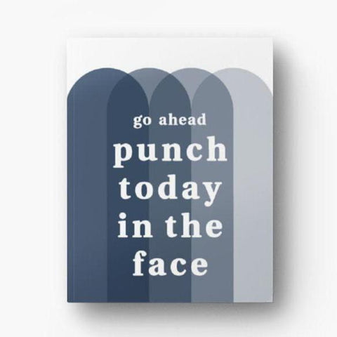 Front cover of unlined 72-page notebook with soft touch cover; "go ahead punch today in the face" in white text atop overlapping arches in shades of navy