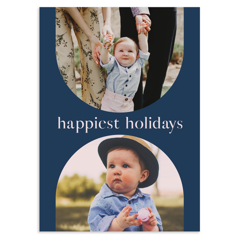  Custom holiday photo card; text reads happiest holidays in blush on navy background; 2 photos in double arches