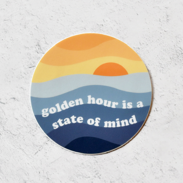 Golden Hour is a State of Mind vinyl sticker; sunset over blue waves; 3" round