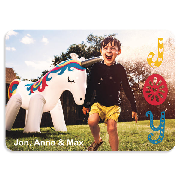 JOY holiday photo card; 5" x 7" horizontal orientation; one photo on front with colorful lettering; fully customizable back
