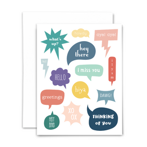 Thinking of you blank greeting card; 14 colorful speech bubbles with various forms of greetings on white background; with white envelope