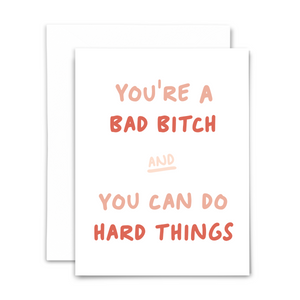 'You're a bad bish and you can do hard things' greeting card with blank interior; pink and coral text on white
