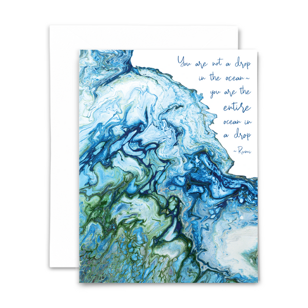 A2 folded blank greeting card with print of acrylic pour painting and quote "You are not a drop in the ocean- you are the entire ocean in a drop." (Rumi) Color profile: blues & greens; with white envelope.