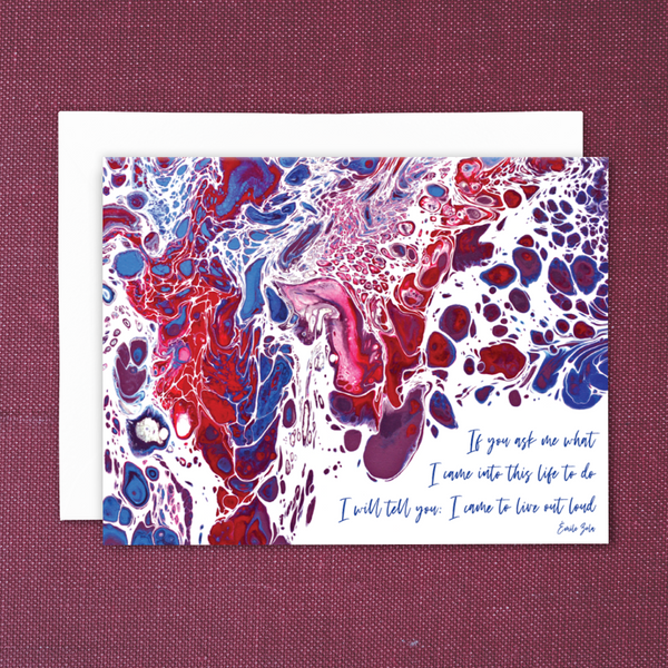 A2 folded blank greeting card with print of acrylic pour painting and quote, "If you ask me what I came into this life to do, I will tell you: I came to live out loud." (Emile Zola) Color profile: reds, purples, blues; with white envelope. On burgundy-colored cloth background.