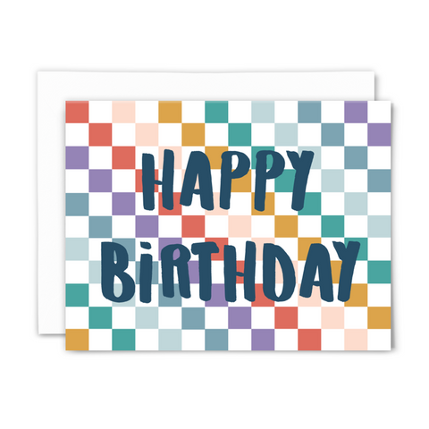 blank greeting card, "happy birthday" in chunky navy hand script on rainbow checkered background with white envelope