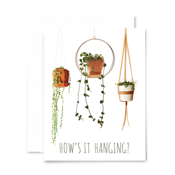 "How's it hanging?" blank greeting card from "Planty Puns" collection, featuring string of pearls, string of turtles, and peperomia hope
