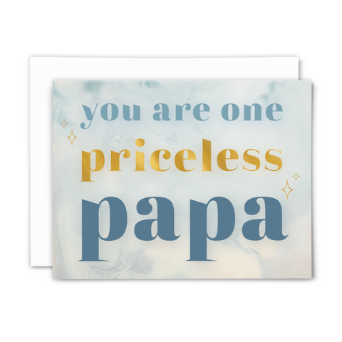 Blank greeting card "you are one priceless papa"; blue and gold font on light blue background with gold stars; with white envelope