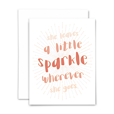 "She leaves a little sparkle wherever she goes" blank greeting card; funky bold pink font with starburst on white background; with white envelope