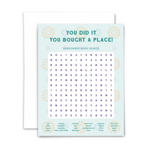Homeowner word search greeting card "you did it you bought a place!" in green font on mint green background with gold, blue and purple confettii; 24-word word search with answers on back and blank interior; with white envelope
