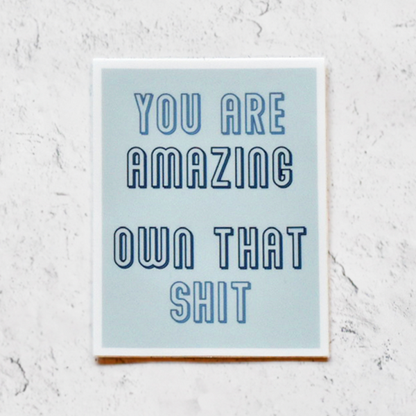 You are amazing; own that sh!t vinyl sticker; blue lettering on light blue background